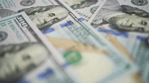 Close up of one hundred US dollar bills in messy pile Stock Footage 334046419