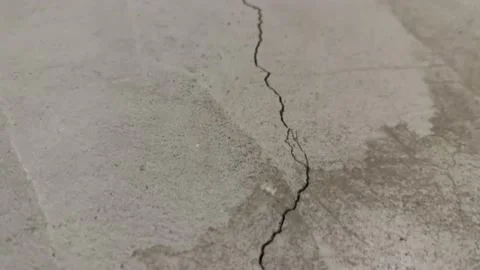 Close up of one long crack in concrete foundation in basement from Stock Footage 229840077