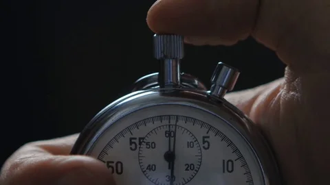 Close up of One person starting up a stopwatch Stock Footage 74014337