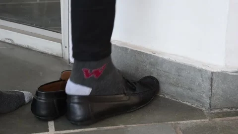 Close up of one person's feet walking inside the house Stock Footage 130682095