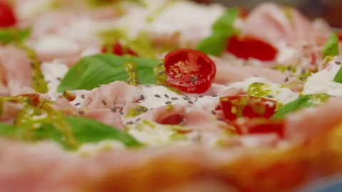 Close-up of one of the species of pizza on the baking sheet in a pizzeria in Stock Footage 306061608