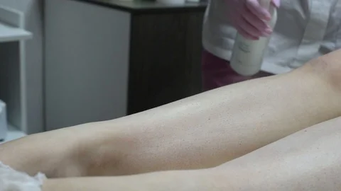 Close-up of one of the stages of the procedure for removing hair on the legs Stock Footage 118705585
