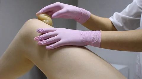 Close-up of one of the stages of the procedure for removing hair on the legs 스톡 동영상 119295221