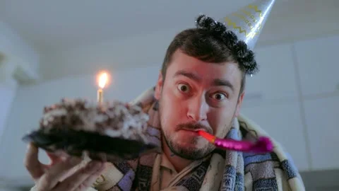 Close Up One Surprised Man In Blanket Blowing Horn Holding Cake Stockbeeldmateriaal 334042727