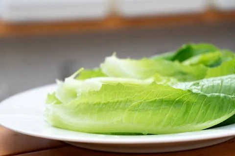 Close up one vegetable in the white dish on the wood table Stock Photos