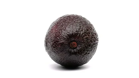 Close up of one whole avocado rotating on the white background. Stock-Footage 157038822
