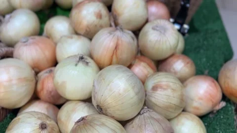 Close-up of onions with smooth outer layers and natural texture Stock Footage 312095408