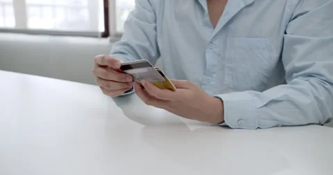 Close-up of online payment processes modern finance in a bright home office Stock Footage 301590469