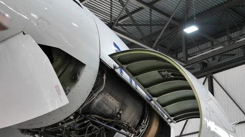 Close Up Open Aircraft Jet Engine in Maintenance Facility. Tilt Down Stock Footage 129427503