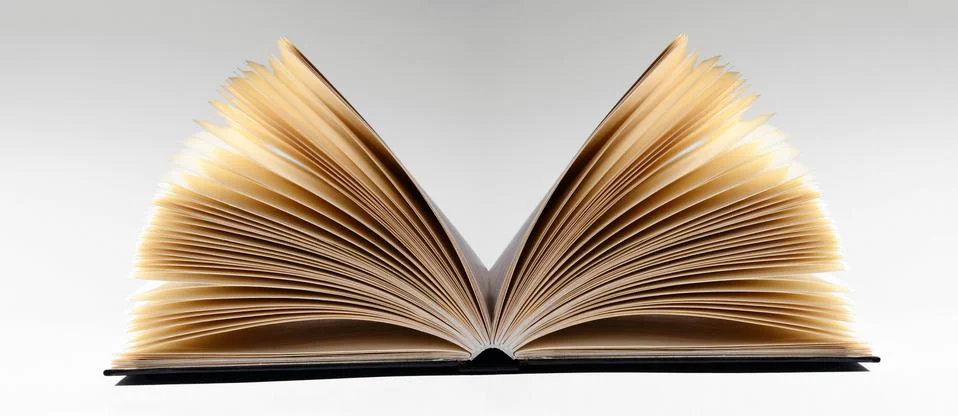 Close-up of an open book, on gray background Stock Photos