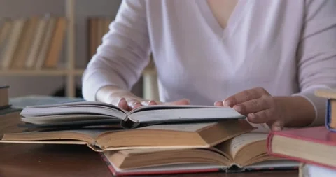 Close-up of open book, smoothing pages, starting to read with interest, learning Stock Footage 130367063
