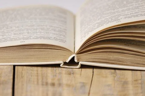 Close-up of an open book on the table. Stock Photos