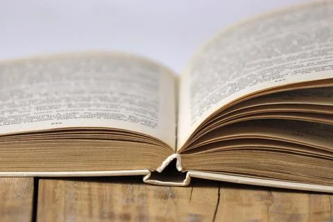 Close-up of an open book on the table. Stock Photos