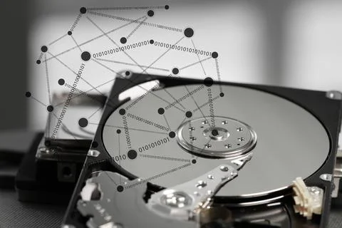 Close up of open computer hard disk drive on desk and notebook Stock Photos