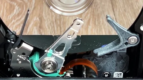 Close up of an open computer internal hard drive movement Stock Footage 283658015