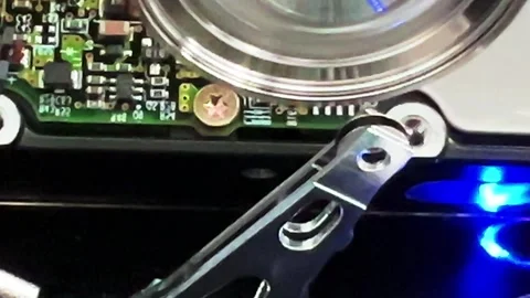 Close up of an open computer internal hard drive movement Stock Footage 283658019