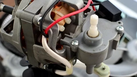 Close-up of an open fan motor, showcasing intricate wires and copper compon.. Stock Footage 260822788