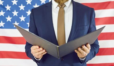 Close up of open folder in hands of unknown man in business suit on background Stock Photos