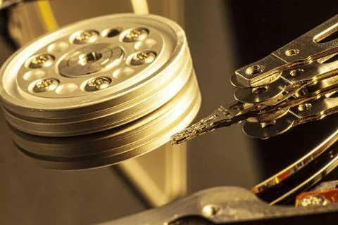  Close-up of an open hard disk drive reading data, with actuator arm and p... Stock Photos