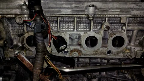 Close-up of open intake ports on a car engine cylinder head Stock Footage 340415060