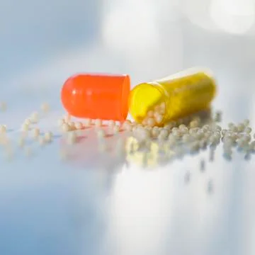 Close up of open medication capsule Stock Photos