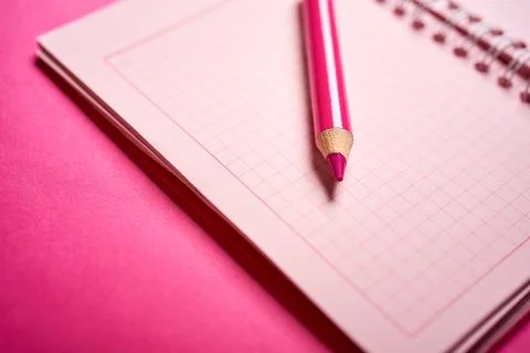 Close up of open notebook and pencil on blurred desk Stock Photos
