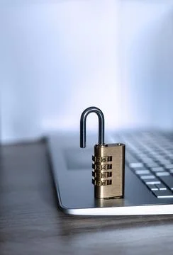 Close-up of an open numeric padlock on a laptop Stock Photos