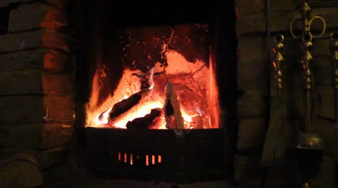 Close up Of Open Old Wood Fireplace Lit With Flames With Brushes Stock Footage 36769351