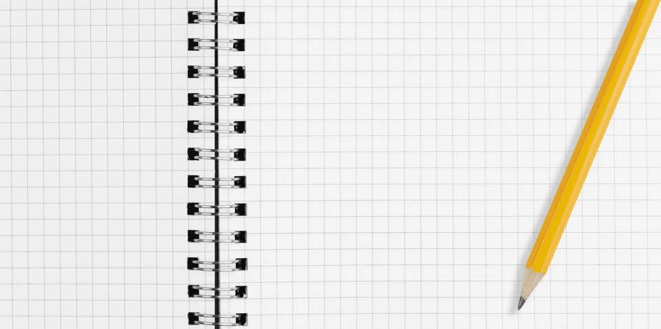 Close up of open spiral notebook graph paper page with sharp yellow pencil Stock Photos