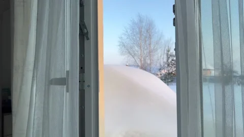 Close-up of an open white balcony door handle with sheer curtain  Vidéo 328235518