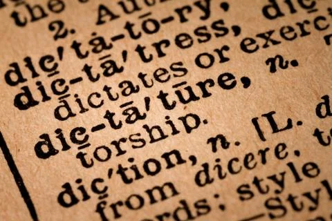 Close-up of an Opened Dictionary showing the Word DICTATURE 스톡 사진