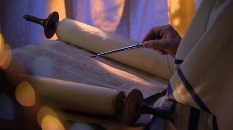 Close-up of opened Torah, reader's hand following lines with stylus Stock Footage 59537243