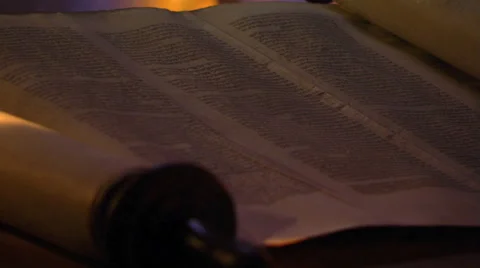 Close-up of opened Torah, shadow of Star of David falling on page Stock Footage 59537286
