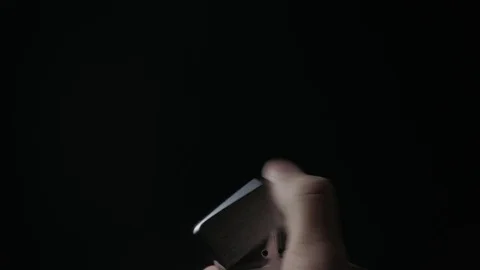 Close-up of the opening and the burning of iron Zippo lighter on a black Stock Footage 84102008