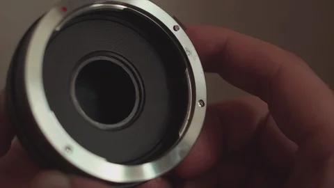 Close-up of the opening and closing of the lens aperture. Stock Footage 104768467