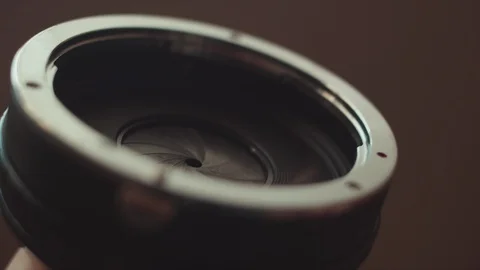 Close-up of the opening and closing of the lens aperture. Stock Footage 104769412