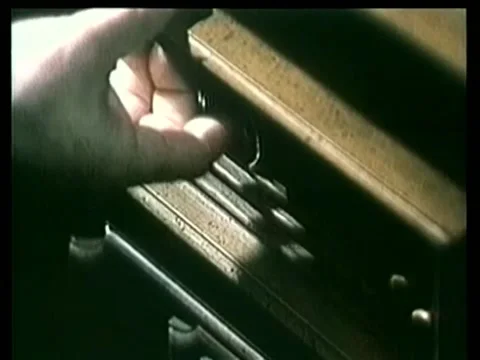 Close-up opening drawer containing gun and money Stock Footage 260247501