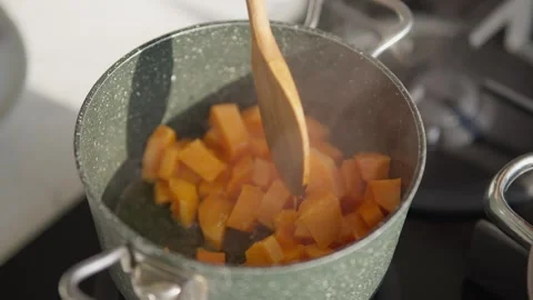 Close Up of Opening Steaming Cooking Pot in Modern Kitchen Stock Footage 336466827