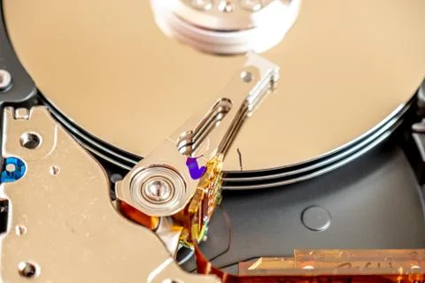 Close-up of an operating computer harddisk reading and writing data Stock Photos