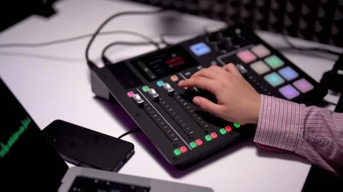 Close up of operating a soundboard in acoustic studio Stock Footage 242284186