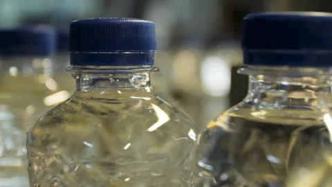 Close-up of the operation of the automatic tightening of the cork on a plasti Stock Footage 279919360