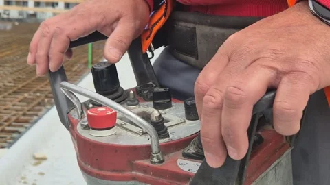 Close Up of Operator Using Concrete Pump Wireless Remote Stock Footage 335591417
