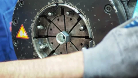 Close up of operator's hands placing hose inside crimping assembly machine Video stock 197755216