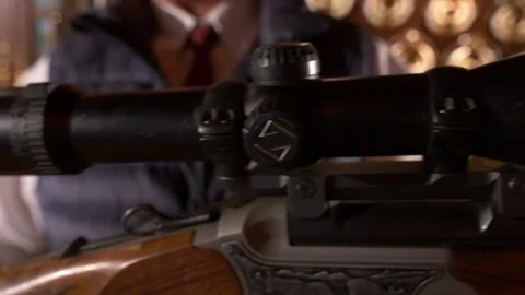 Close-up of the optical sight of a hunting rifle with a professional hunter Stock Footage 328991218