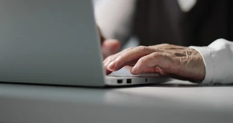 Close-up or elderly woman’s hand working touch pad on laptop computer at the Vídeo Stock 109311619