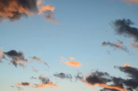 Close-up of orange and  dark  clouds   after   rain and storm  at sunset agai Stock Photos