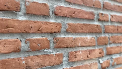 Close-up of orange brick wall texture with rough surfaces Stock Footage 312096249