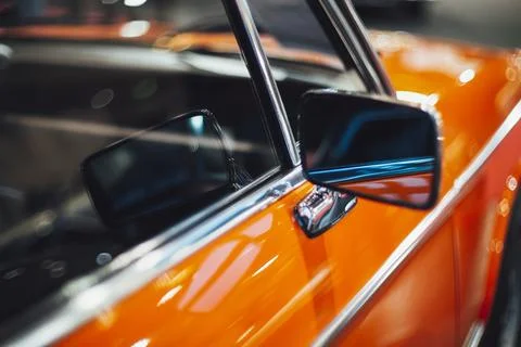 Close up of an orange car wing mirror Stock Photos