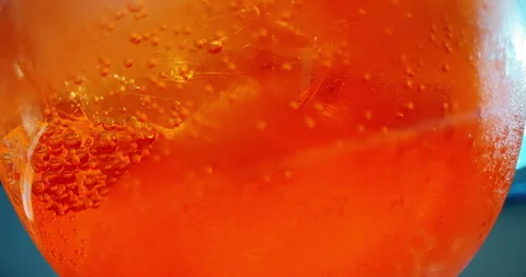 Close-up of orange cocktail with ice cubes for background Stock Footage 254786351