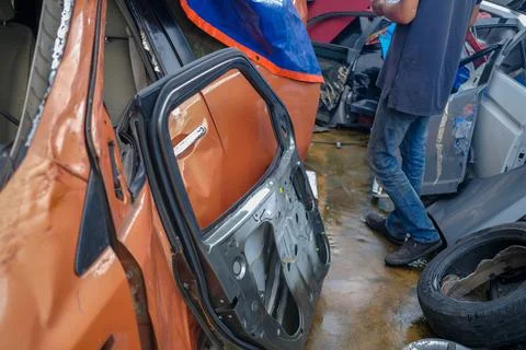 Close up of orange  crashed car  in preparation of repair work, Make the surf Stock Photos